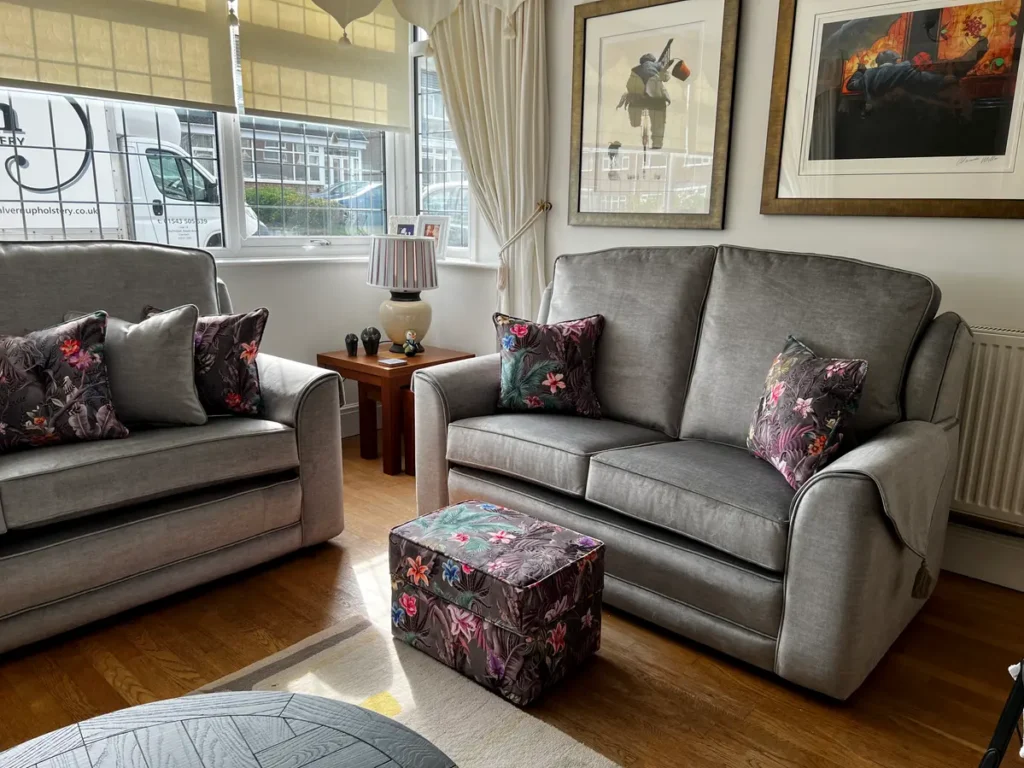 Sandringham suite - pair of handmade grey velvet sofas with floral accent cushions and matching footstool, by Ralvern Upholstery Cannock