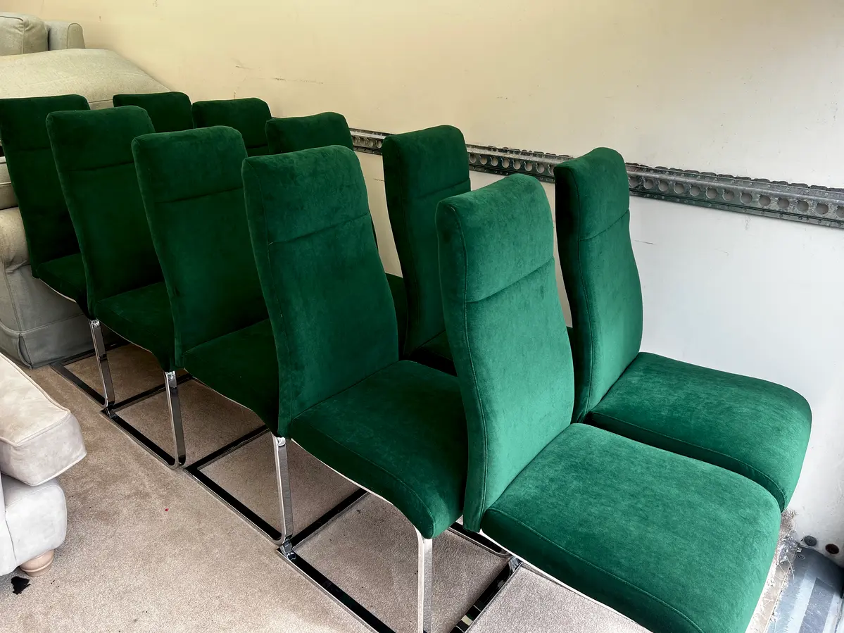 Green dining chairs in a row